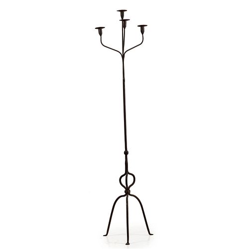 A Wrought Iron Four Light Floor Candlestand with Penny Feet
