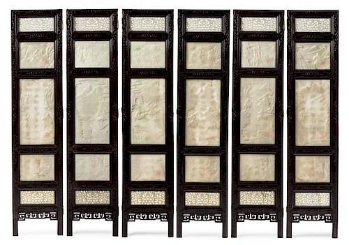 A Chinese White Jade Inset Rosewood Six-Panel Floor Screen 20TH CENTURY Height 77 1/4 x width 17 3/8 inches.