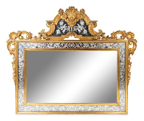 A Venetian Rococo Style Giltwood and Etched Glass Mirror
Height 59 x length 75 inches.
