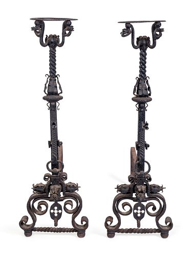 A Pair of Renaissance Style Wrought-Iron Andirons
Height 41 x width 13 x depth 36 inches.