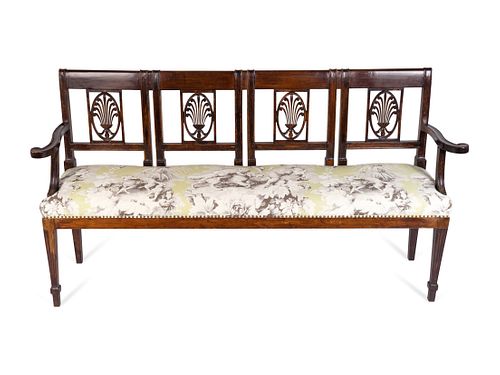 An Italian Neoclassical Carved Mahogany Quadruple Chairback Settee
Height 36 x length 67 x depth 16 inches.
