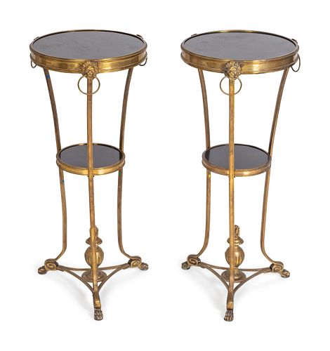 A Pair of Neoclassical Style Gilt-Bronze and Black Granite Gueridons
Height 28 1/4 x diameter 12 1/4 inches.