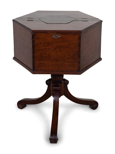A George III Style Mahogany Hexagonal Cellarette
Height 31 x width 25 x depth 21 1/2 inches.