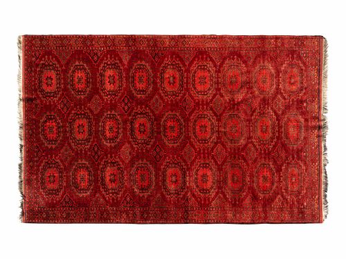 A Bokhara Wool Rug
9 feet 4 inches x 5 feet 11 inches.