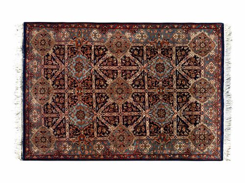 An Indo-Persian Wool Rug
5 feet 11 inches x 4 feet 1 inch.