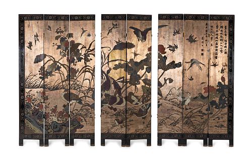 A Chinese Polychromed Eight Panel Coromandel Screen
Height of each panel 83 1/2 x width 16 inches.