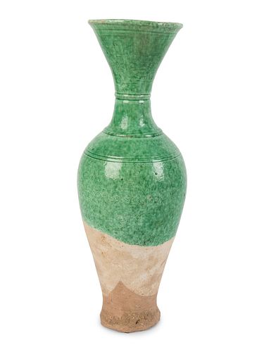A Chinese Green Glazed Pottery Vase
Height 13 1/2 x diameter 4 1/2 inches.