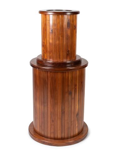 A Neoclassical Style Mahogany Columnar Revolving Pedestal
Height 47 inches, top diameter 15 1/2 inches.