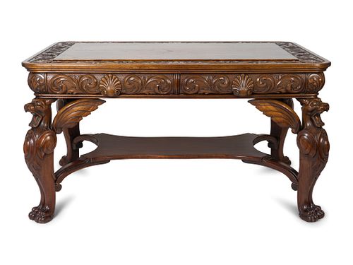 An American Renaissance Carved Mahogany Library Table
Height 29 x length 55 x width 36 inches.