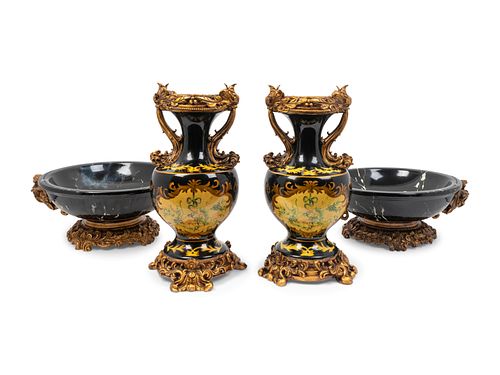 A Pair of Simulated Marble Vases and a Matching Pair of Bowls
Height of vases 16 x width 8 inches; height of bowls 6 1/2 x diameter 14 1/2 inches.