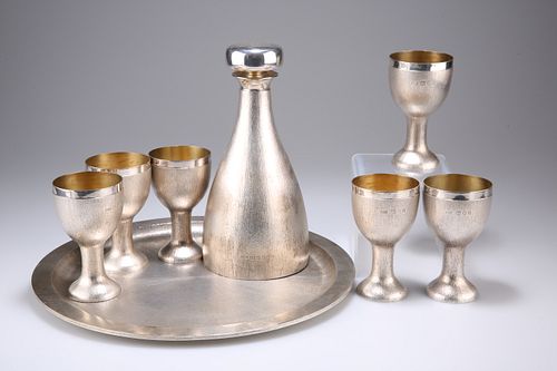 AN EIGHT-PIECE SILVER DRINKS SET, by House of Lawrian for C