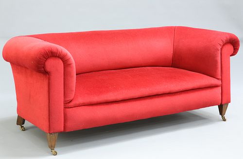 A HOWARD AND SONS RED VELVET UPHOLSTERED MAHOGANY SOFA, wit