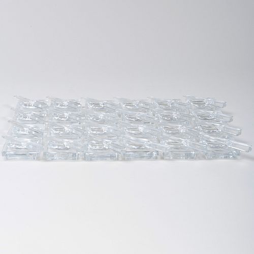 Twenty-Four Baccarat Glass Knife Form Rests and Twenty-Four Butter Pats