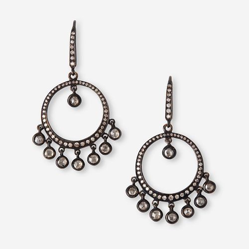 A pair of diamond and silver topped eighteen karat gold earrings,