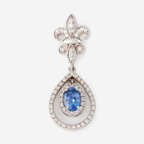 A sapphire, diamond, and eighteen karat white gold pendant,