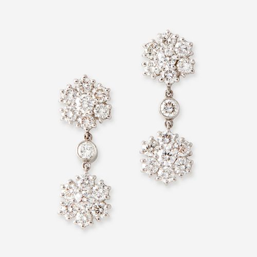 A pair of diamond and platinum earrings,