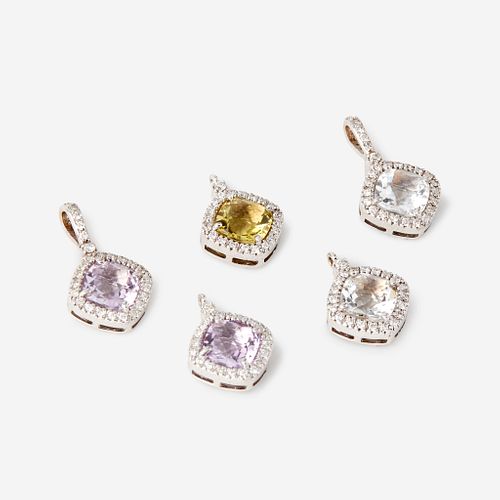 A collection of five gem-set, diamond, and eighteen karat white gold pendants,