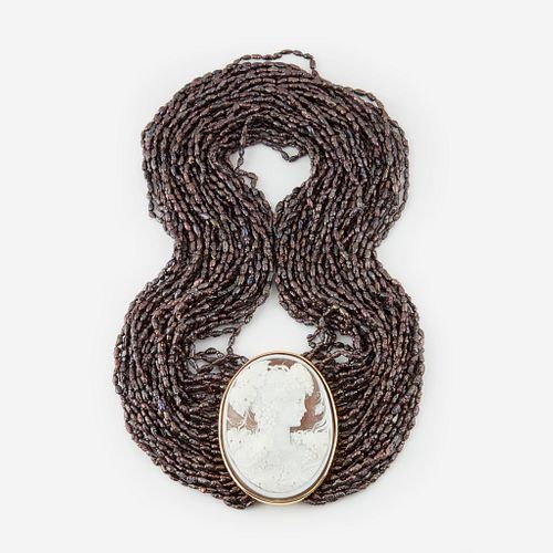 A cameo, Tahitian black cultured seed pearl, and eighteen karat gold necklace,