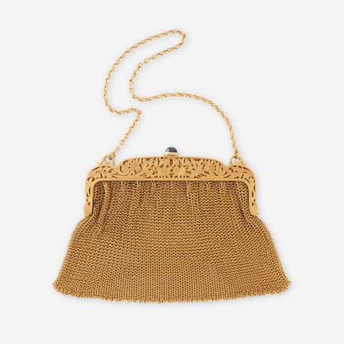 A fourteen karat gold mesh purse,