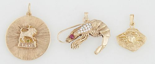 Group of Three 14K Yellow Gold Pendants, consisting of a shrimp mounted with a red stone and small round diamonds; a "Leo" zodiac pendant mounted with