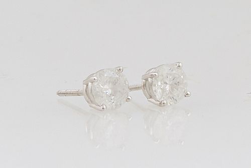 Pair of 14K White Gold Diamond Stud Earrings, each with a .53 ct. round diamond on a screwback post, total diamond wt.- 1.06 cts., with appraisal.