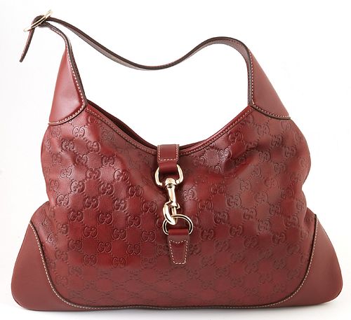 Gucci Dark Red Guccissima Leather Jackie O Hook Closure Shoulder Bag, the adjustable strap with gold hardware and leather flap with a gold swivel clas