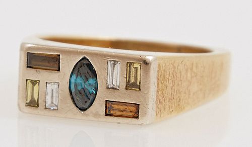 Man's 18K Yellow Gold Dinner Ring, the rectangular top with a central channel set .3 carat marquise green tourmaline, flanked by channel set baguette 