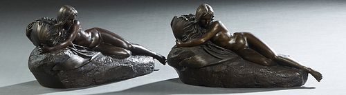 Pair of Patinated Bronze Figural Candlesticks, 20th/21st c., with a reclining female nude holding the candle cup, H.- 6 3/4 in., W.- 12 1/2in., D.- 4 