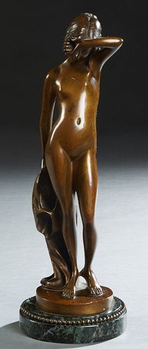 Continental School, "Lady Entering the Bath," early 20th c., patinated bronze, the integral base incised "Musee di Napoli," mounted on a stepped bronz