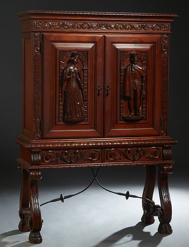 French Renaissance Carved Cherry China Cabinet, 20th c., the stepped carved edge crown over double doors with high relief carvings of a king and a que