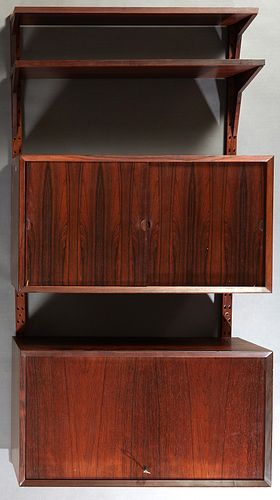 Mid Century Modern Carved Rosewood Bookshelf, 20th c., with two open adjustable shelves, above a double sliding door cupboard, to a lower fall front d
