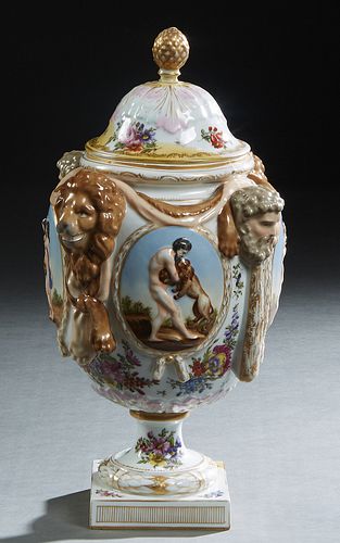 Eugene Claus, Meissen Style Covered Porcelain Urn, 19th c., with gilt and polychromed decoration, the lid with an artichoke finial, over sloping sides