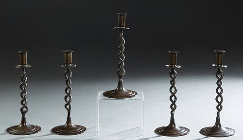 Group of Five English Brass Candlesticks, 20th c., with an open twisted support, on a stepped circular base, H.- 10 in., Dia.- 4 3/8 in. (5 Pcs.)