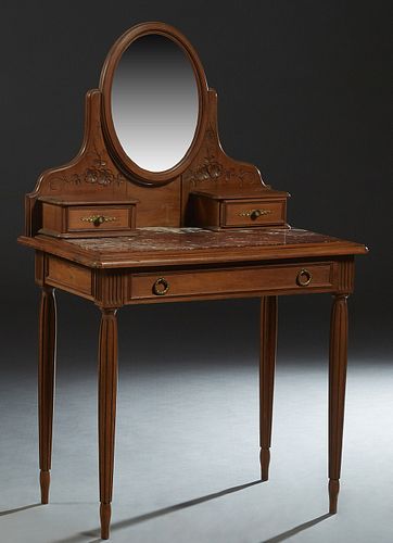 French Art Nouveau Carved Walnut Marble Top Dressing Table, c. 1900, with an oval beveled swivel mirror flanked by floral carving and small drawers, o