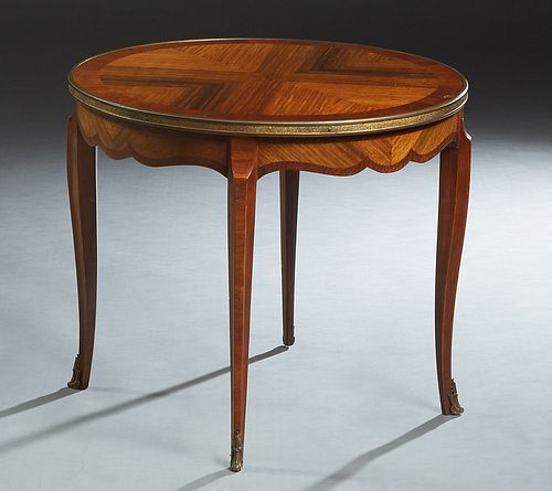 French Ormolu Mounted Inlaid Mahogany and Rosewood Coffee Table, 20th c., the circular top within a brass band, over a shaped scalloped skirt, on cabr