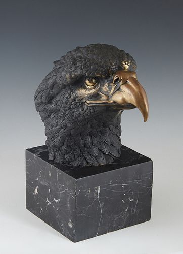 Gilt and Patinated Bronze Eagle Head, 20th c., on a large square figured black marble plinth, H.- 11 in., W.- 5 1/2 in., D.- 9 3/4 in.
