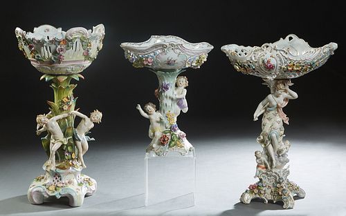 Group of Three Porcelain Dresden Style Figural Centerpieces, late 19th c., with applied porcelain flower heads, one by Carl Knoll, Fischern, the base 