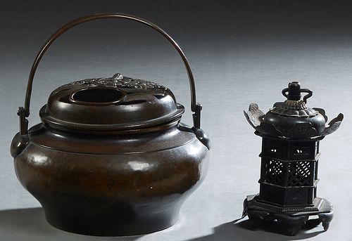 Two Chinese Censers, late 19th c., one of bronze baluster kettle form with a folding handle, the pierced lid with a relief male figure amongst waves; 