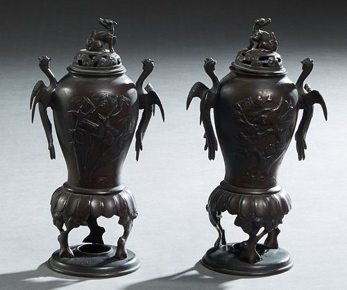 Pair of Chinese Bronze Censers, late 19th c., of tapering baluster form, with relief bird and bamboo decoration, the sides with bird handles, to tripo