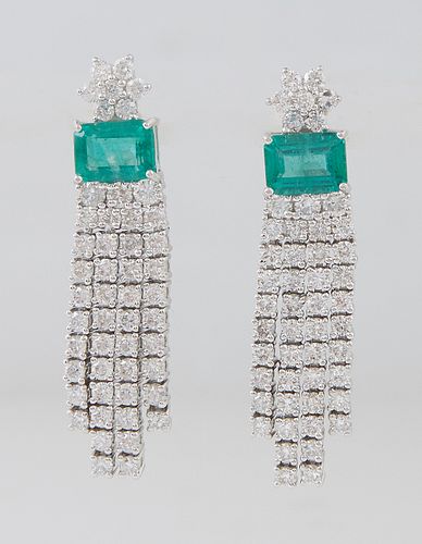 Pair of Platinum Pendant Earrings, the diamond mounted florifom stud suspending a 1.64 ct. emerald atop a double border of round diamonds, suspending 