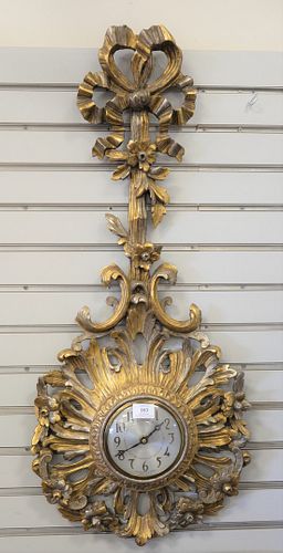Continental Style Sessions Wall Clock, having carved wood gilt ribbon and scrolling foliate and flower design, height 38 inches.