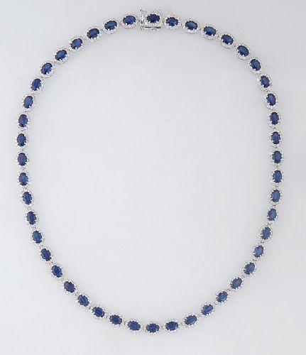 14K White Gold Link Necklace, each of the forty-six oval links with an oval blue sapphire atop a border of round diamonds, total sapphire wt.- 26.11 c