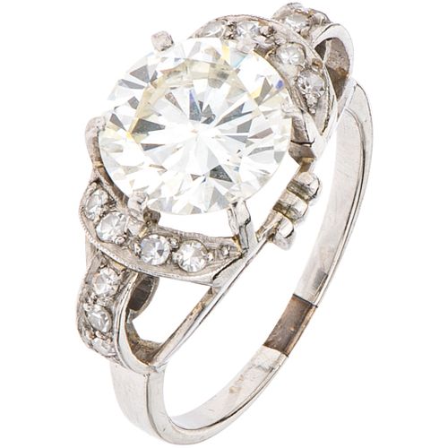 DIAMOND RING IN PALLADIUM SILVER AND PLATINUM 1 Brilliant cut diamond ~2.60 ct Clarity: VS2-SI1, 14 8x8 cut diamonds
