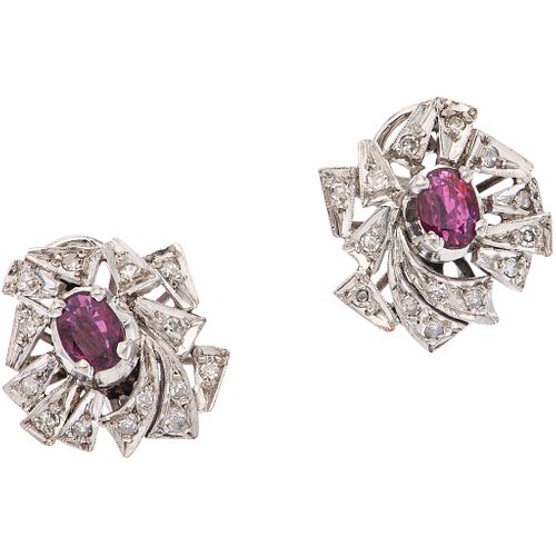 PAIR OF EARRINGS WITH RUBIES AND DIAMONDS IN PALLADIUM SILVER 2 Oval cut rubies ~0.60 ct, 28 8x8 cut diamonds ~0.28 ct