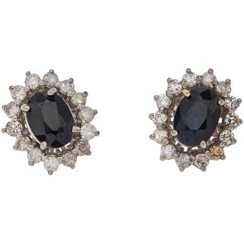 PAIR OF STUD EARRINGS WITH SAPPHIRES AND DIAMONDS IN 14K WHITE GOLD 2 Oval cut sapphires ~1.70 ct, 28 8x8 and brilliant cut diamonds
