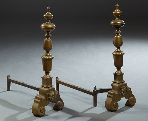 Pair of Large Continental Brass Andirons, 20th c., with acorn finial tops on knopped supports, to a large reeded urn support, on a scrolled trestle ba