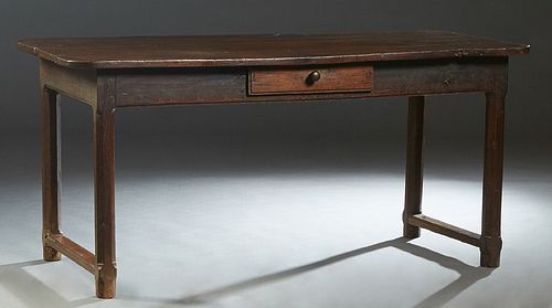 French Provincial Carved Oak Farmhouse Table, 19th c., the rounded corner three board top over a frieze drawer on one long side, on octagonal legs joi