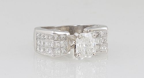 Lady's Platinum Dinner Ring, with a 1.52 ct. radiant cut diamond, flanked