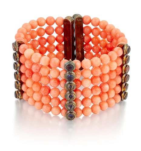 A CORAL AND IOLITE BRACELET, six rows of coral beads, space
