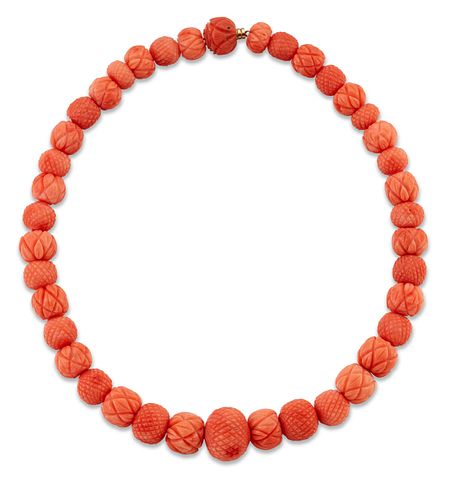 A CORAL BEAD NECKLACE,?graduated coral beads, carved with a
